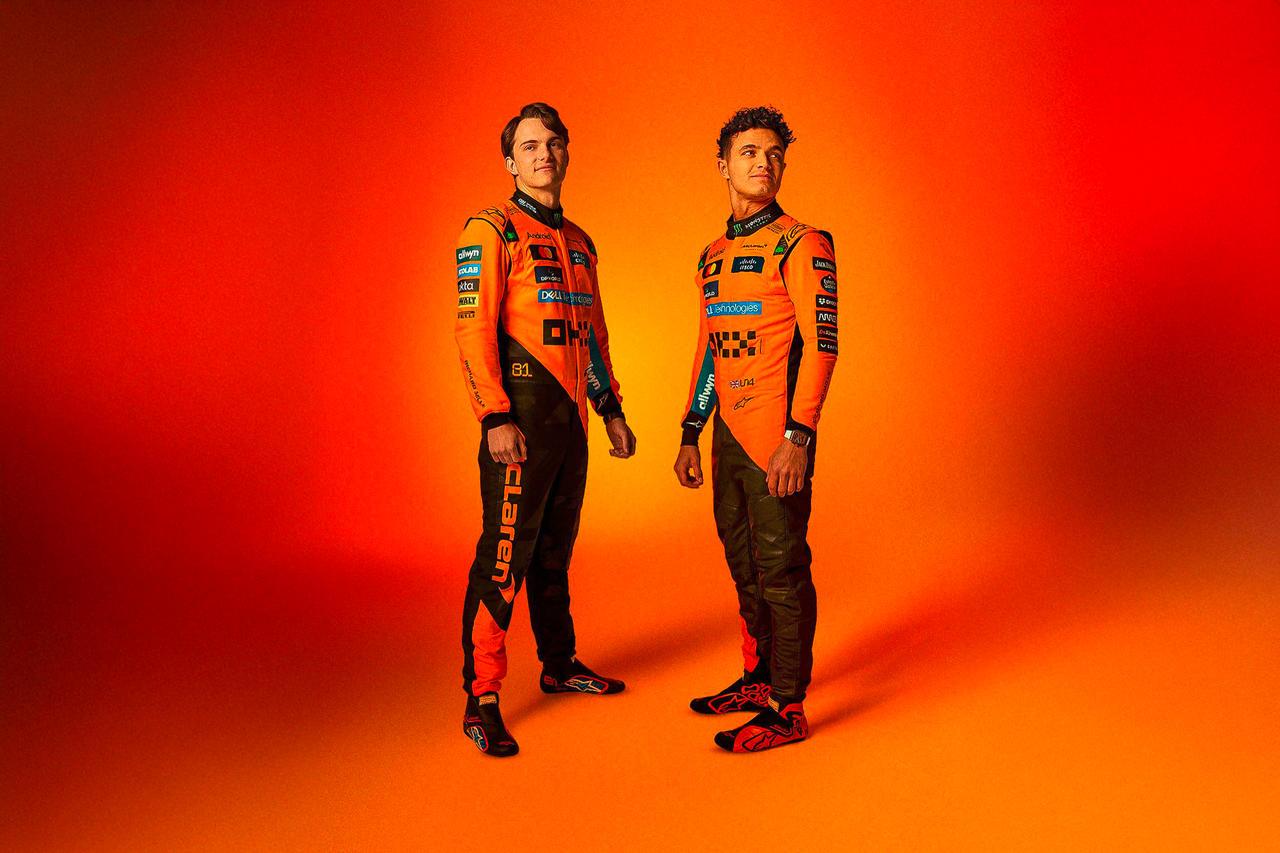 Ultimate Go-Kart Racing Suit - Premium Orange & Black Motorsport Suit with Custom Embroidered Logos, featuring sponsor patches from Dell Technologies, Cisco, and Android, made with durable Cardura 600D outer material, cotton terry lining, 3D digital sublimation printing, stretch panels, and breathable vents, ideal for racers seeking performance and style.